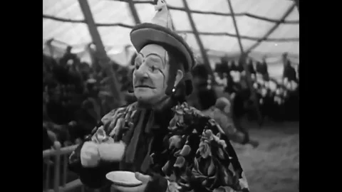 Prancing horses perform tricks in all 3 rings inside this 1940?s, 3 ring circus Stock Footage 79427849