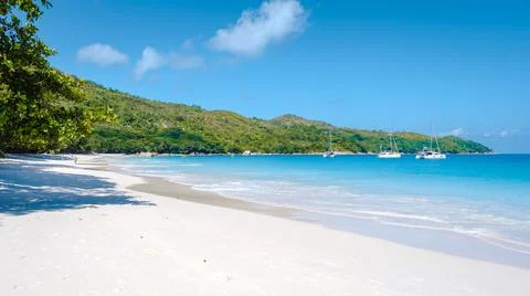 Praslin Seychelles tropical island with withe beaches and palm trees, Anse Lazio Stock Photos