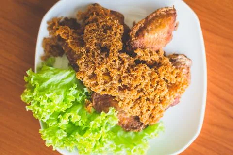 Prawn paste crispy fried chicken served on lettuce leaf and white plate Stock Photos