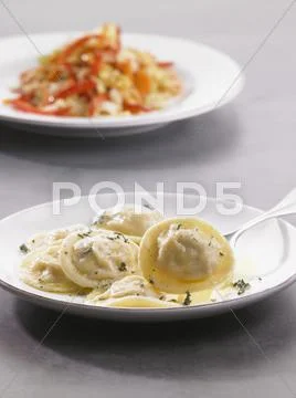 Prawn ravioli with herb butter Stock Photos