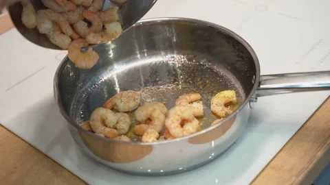 Prawns are fried in a frying pan Stock Footage 148552955