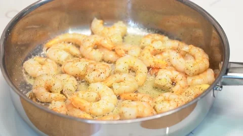 Prawns are fried in a frying pan Stock Footage 148552964