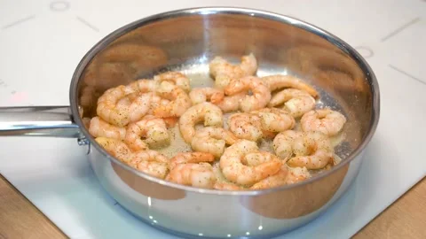 Prawns are fried in a frying pan Stock Footage 148552986