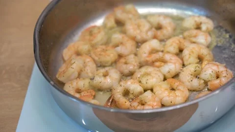 Prawns are fried in a frying pan Stock Footage 148553003