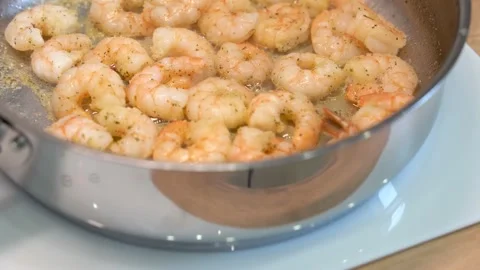 Prawns are fried in a frying pan Stock Footage 148553028