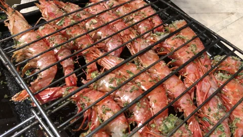 Prawns on barbecue close up shot Stock Footage 130982009
