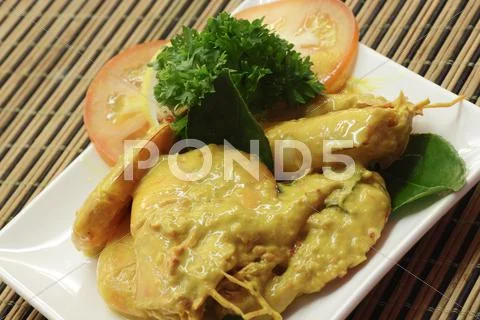 Prawns in fermented durian sauce Stock Photos