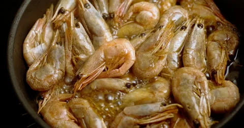 Prawns frying in a pan Stock Footage 131204754
