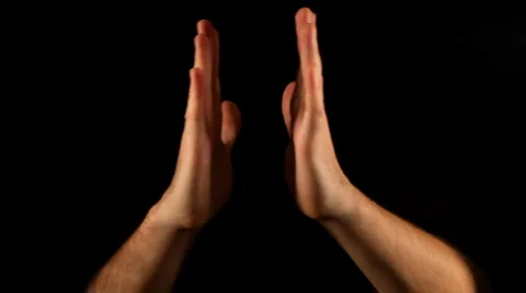 Pray gesture on black background Stock Footage