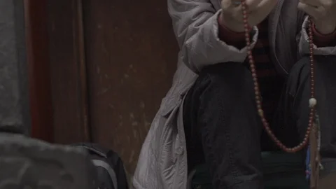Prayer beads run through fingers Stock Footage 87787629