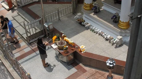 Prayer at Buddhist shrine Stock Footage 129810157