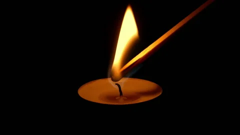 Prayer Candle Is Lit In The Dark And Goes Out Stock Footage