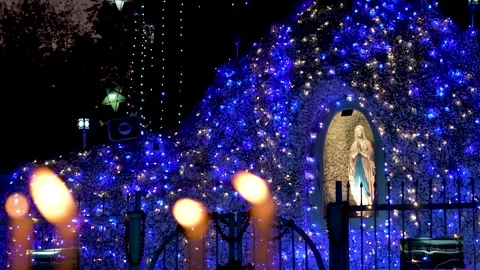 Prayer Candles Burning in Front of Jesus Christ Symbol Stock Footage 327400171