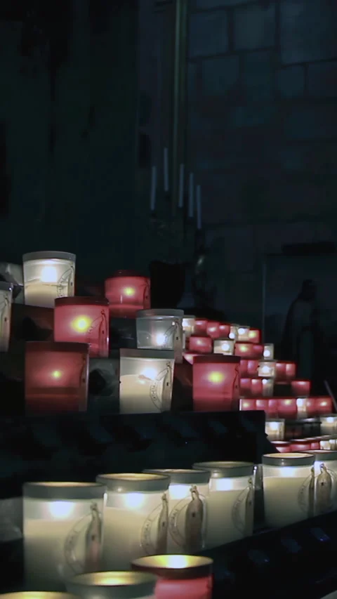 Prayer Candles Glowing Inside Notre Dame Cathedral, Paris - 4K Vertical Stock Footage 328130529