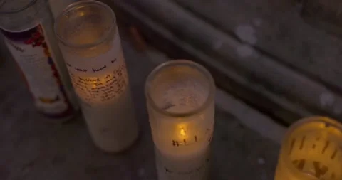 Prayer candles placed next to a water fountain Vídeos de archivo 159085667