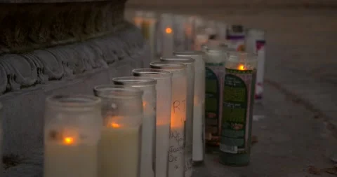 Prayer candles placed next to a water fountain Vídeos de archivo 159085701