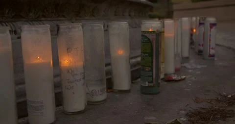Prayer candles placed next to a water fountain Vídeos de archivo 159085855