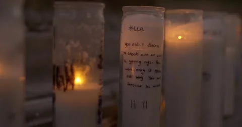 Prayer candles placed next to a water fountain Vídeos de archivo 159085932