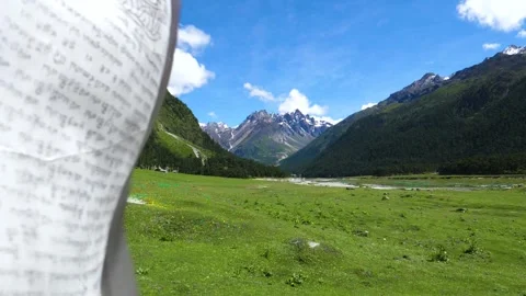 Prayer Flag blowing in front of Beautiful Himalayan Mountain Stock Footage 139231494