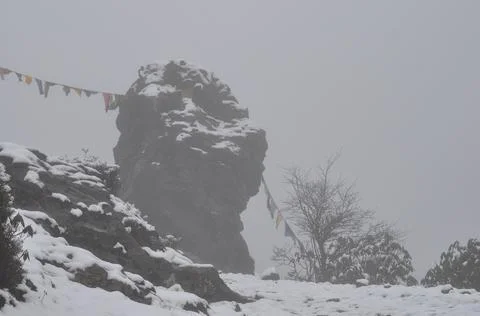 Prayer flag on stone Stock Photos