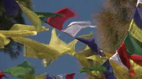 Prayer flags agaisnt blue sky Stock Footage 10787615