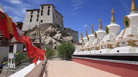 Prayer flags and many tibetan Stupa. Thiksey monastery. Leh, Ladakh, India Stock Footage 66424831