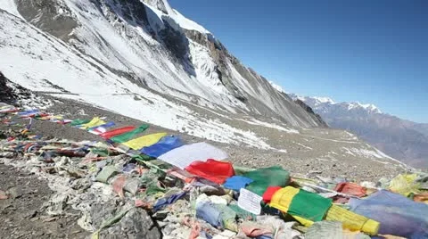 Prayer flags blowing in the high wind at Thorang La Pass, 5416m. 스톡 동영상 20441248