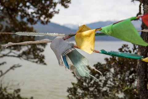Prayer flags blowing in the wind in China Stock Photos