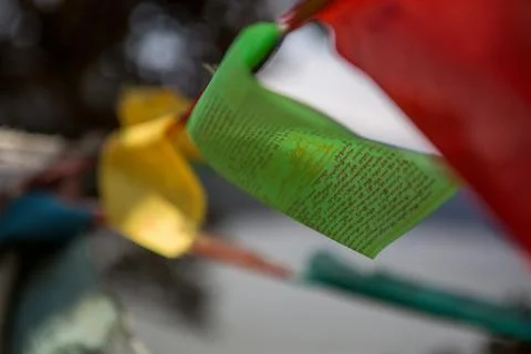 Prayer flags blowing in the wind in China Stock Photos