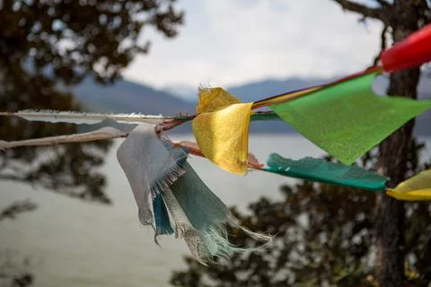 Prayer flags blowing in the wind in China Stock Photos