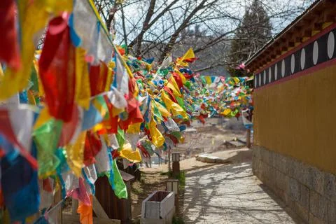 Prayer flags blowing in the wind in China Stock Photos