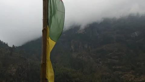 Prayer flags with low clouds passing by in background 스톡 동영상 101443543