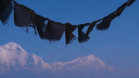 Prayer flags with mountain and blue sky in the background Stock Footage 247198896