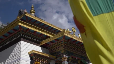 Prayer flags at mountain monastery. Upper Pisang, Nepal. Pisang village is a par Stock Footage 294613149