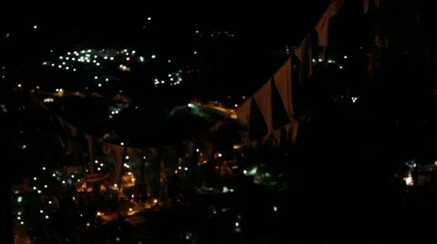 Prayer flags at night hanging over Bhutan capital city Stock Footage 37164090
