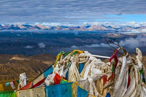 Prayer flags over the eroded mud landscape in the kingdom of Guge Western Tibet Stock Photos