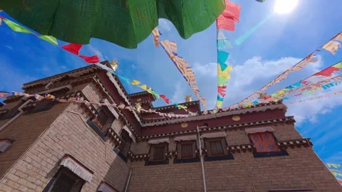 Prayer Flags over Tibetan-style Building — Cultural Harmony in Highland Breeze Stock Footage 312588933