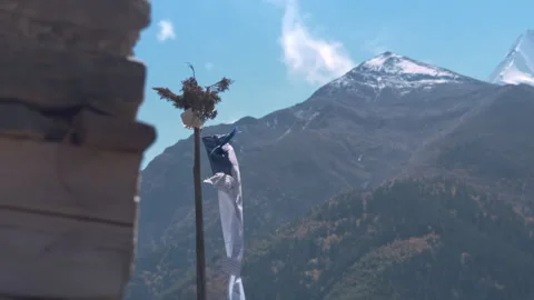 Prayer Flags in Snowcapped Mountains in Nepal, Colorful Tibetan Buddhist Prayer Stock Footage 294612957