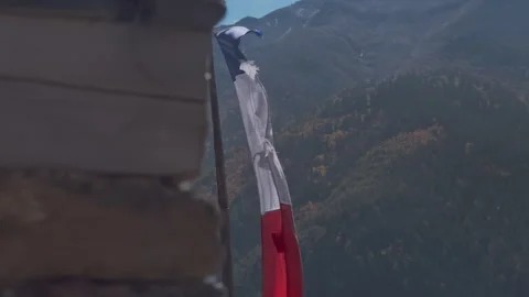 Prayer Flags in Snowcapped Mountains in Nepal, Colorful Tibetan Buddhist Prayer Stock Footage 294613027