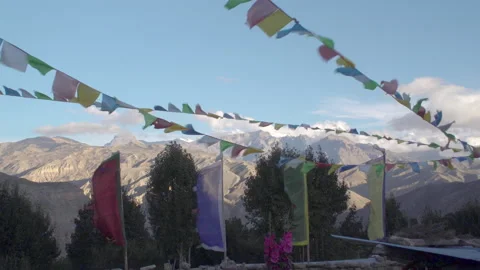 Prayer flags in wind and mountains in background, Mustang, Nepal Video stock 139740877