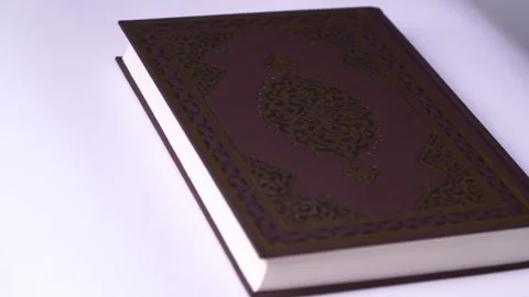 Prayer holly holy muslim quran book in white background Closeup up shot 動画素材 334659853