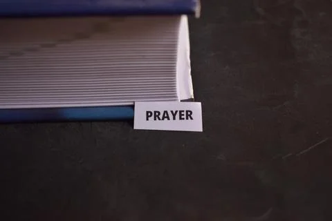 Prayer Paper Tab Inserted in Book Pages Symbolizing Spiritual Connection Stock-Fotos