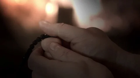 Prayer with rosary Stock Footage 75737860