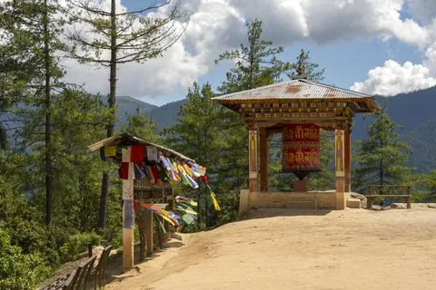 Prayer wheel and flags on trek to tiger's nest Stock Photos