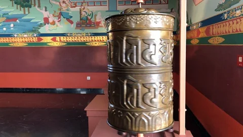 Prayer wheel spinning in a temple Stock Footage 125088881