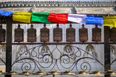 Prayer wheels and prayer flags at Swayambhunath Stupa Stock Photos