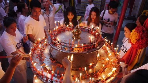 Prayers with Candles in Chinese Shrine Stock Footage 71003667