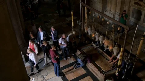 Prayers at the Stone of Anointing in the Holy Sepulcher Church in Jerusalem. Stock Footage 82281555