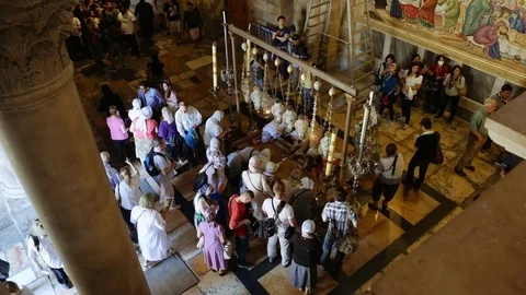 Prayers at the Stone of Anointing in Jerusalem Stock Footage