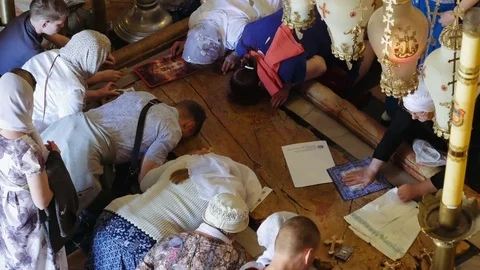 Prayers at the Stone of Anointing in Jerusalem Stock Footage